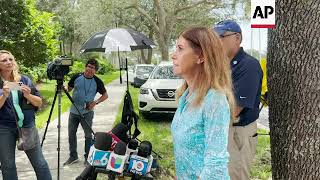 Parkland families walk though massacre site