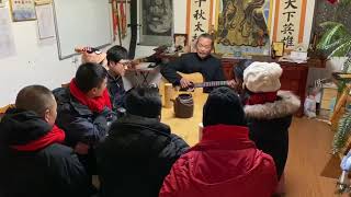 Master Gu Sings a Song With Guitar