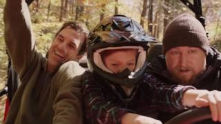 The joyous scene of the father who is driving the off road vehicle to play with children