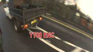 STUPID White Van Man, YT08 ENC ,  Passes on a Corner Over a Bridge, With a Solid White Line