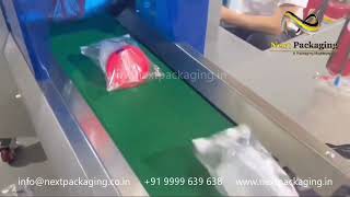 Horizontal flow wrap machine for plastic bottles | jar pouch packing machine