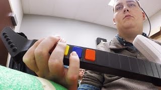 Scientists Help A Paralyzed Man Play 'Guitar Hero' - Newsy