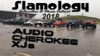 Jeep Cherokee XJs lined up for a picture in the rain Slamology 2018
