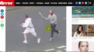 daily uk news:hug brandishing SWORD chases rival down street before fleeing when police car pulls up
