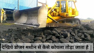 Big size coal broke by dozer machine in power plant