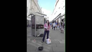 Young lady singing on the streets of Bath