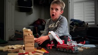 Four Year Old Plays with a Toy Fire Truck