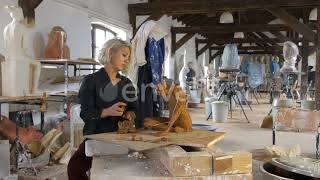 Sculptor is Sculpting a Realistic, Figurative Model in Large Studio | Stock Footage - Envato ele...