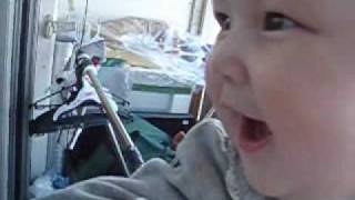 Celina laughing on the balcony.