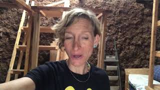 My guests putting in a window for my mud house
