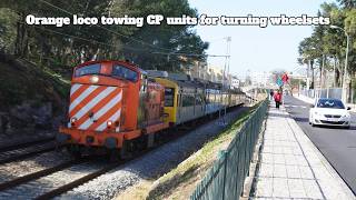 Orange Diesel Loco Taking CP Units for Turning Wheelsets