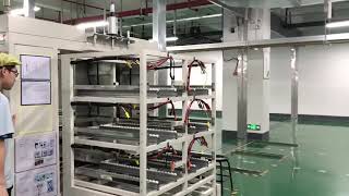 121 QR code guided Shark Elfin AGV 1000 model carry racks in a factory