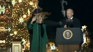 Biden wanders off with the microphone.