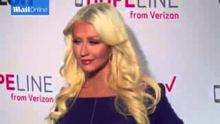 Christina Aguilera shows off curves in pretty fitted dress