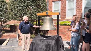 Brooks Keel rings the Augusta University bell as he leaves his office for the final time June 28.