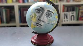 Painting a portrait on a globe (time-lapse)