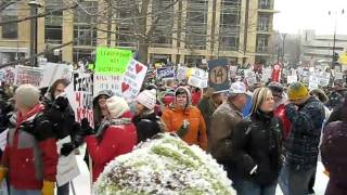 Snow falling on protesters while singing "Which Side Are You On"