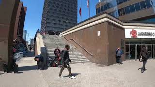 guy walks up and punches other guy in the head at Jackson Square, Hamilton. 😯😯😯