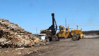 Unloading tree length At Boise in I'Falls