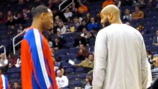 NBA distant cousins talk while live music plays