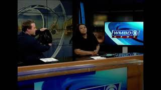News anchor whips out fan on live TV