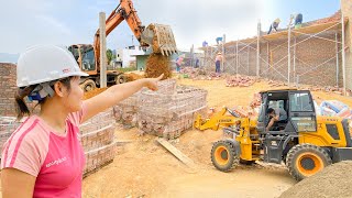 The Process Of Building A Children's Play Area - High Brick Walls and Corrugated Iron Roof