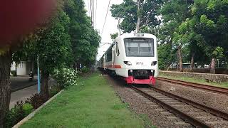 Airport train (trainset no.3/K1 1 17 19) passing Halimun railway crosing
