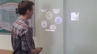 Touch your phone on the wall to share videos!  Ubi Displays
