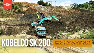 Kobelco SK 200 Excavator Loading Dump Truck