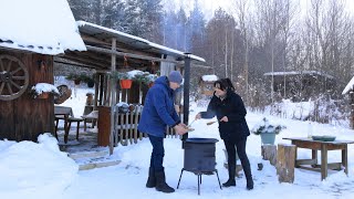 A Snowy day in the Village. A couple's rural life in winter. Cleaning and cooking outside