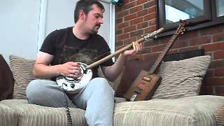 Jaguar Hubcap 3 string guitar cigar box guitar style by hubcap john