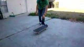 me doing double kickflips in Jeff's backyard