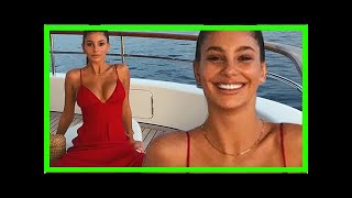 Camila Morrone, 21, poses in plunging red dress on yacht