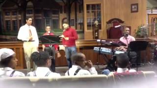 Merton Huff leads a carol