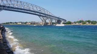 The Huron Lady II and The Lady Tess sail up the St Clair River under the Bluewater Bridge