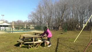 Emma gathering Easter eggs