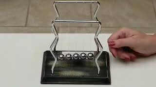 Science Spotlight:  NewtonsCradle, Newton's First Law, and Newton's Third Law
