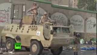 Troops use armoured bulldozers and tear gas to control Morsi's Muslim Brotherhood Supporters