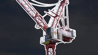 Cranes and Machines Working at Real Construction Site