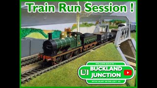 Running model railway trains all afternoon. A train running session we a friend. All four main lines