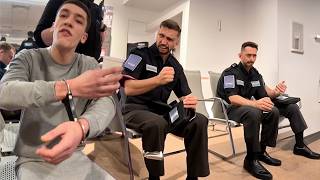 Handcuffed prisoner freestyles in hospital waiting room.