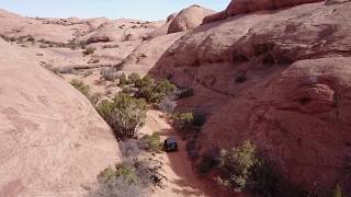 Drone shot of JK Rubicon on Poison Spider, Moab
