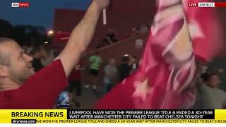 Fans scale side of Anfield after Liverpool FC win Premier League
