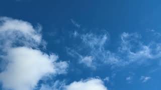 How are clouds moving in the opposite directions