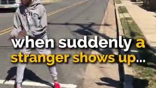 A stranger stops a street fight