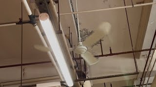 Many brand new SMC K56 and K48 industrial ceiling fans, and others, at a public market
