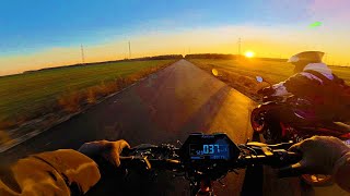Kukirin G2 Master Riding Alongside KTM 125 Duke at Sunset
