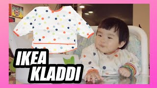 LayLay wearing  IKEA KLADDIG Soft Baby Feeding Bib to eat, keeping her skirt very tidy!!