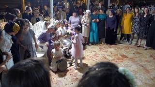 women sing seated bride