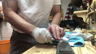 Sharpening an inexpensive pocket knife with a basic oil stone.